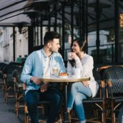 man and a woman on a date at a cafe